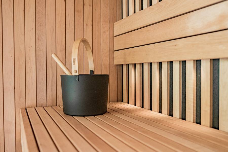 Bucket and ladle on the sauna bench
