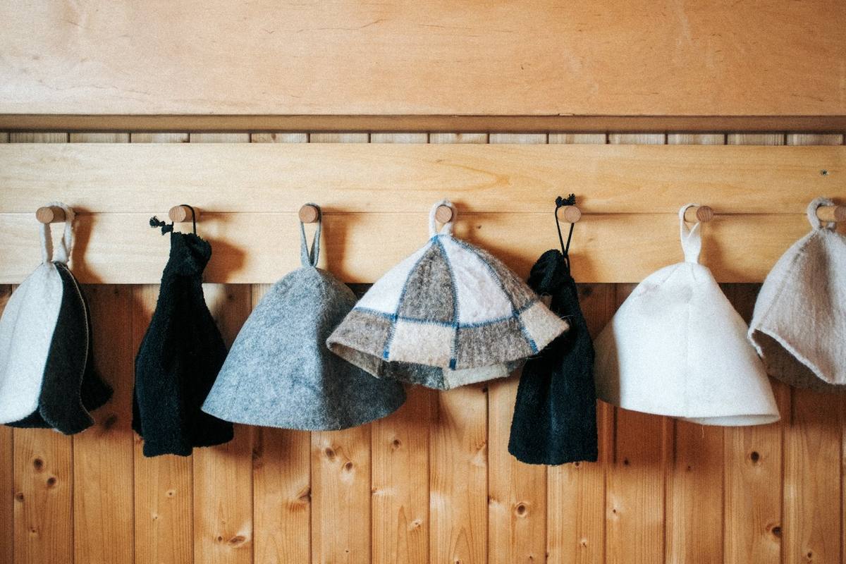 Felt sauna hats on hooks